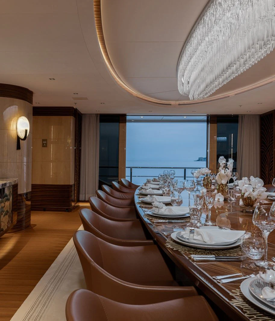 a dining room with a large table and chairs aboard ENERGY Yacht for Sale