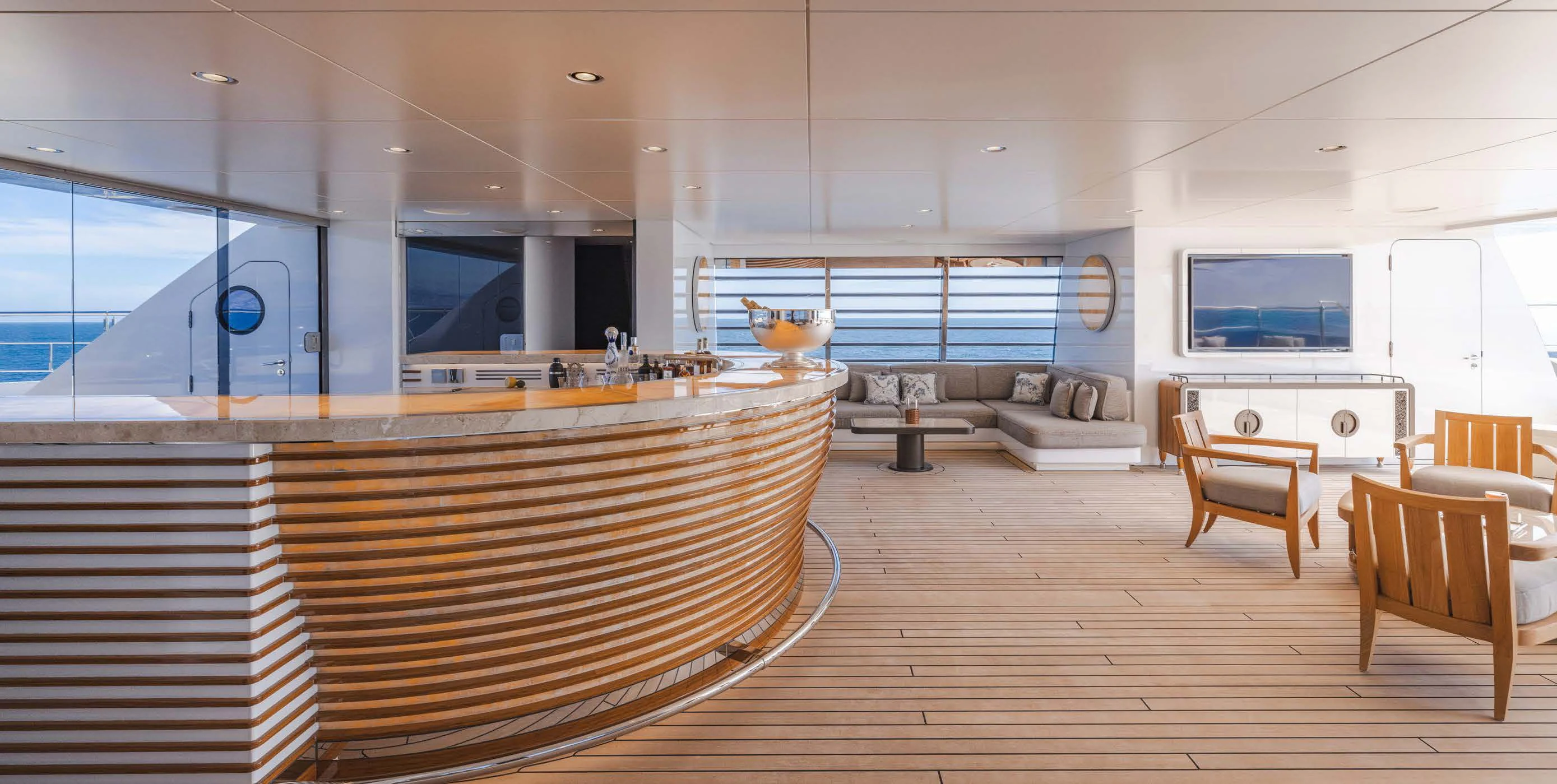 a room with a wood floor and a couch and a tv aboard ENERGY Yacht for Sale