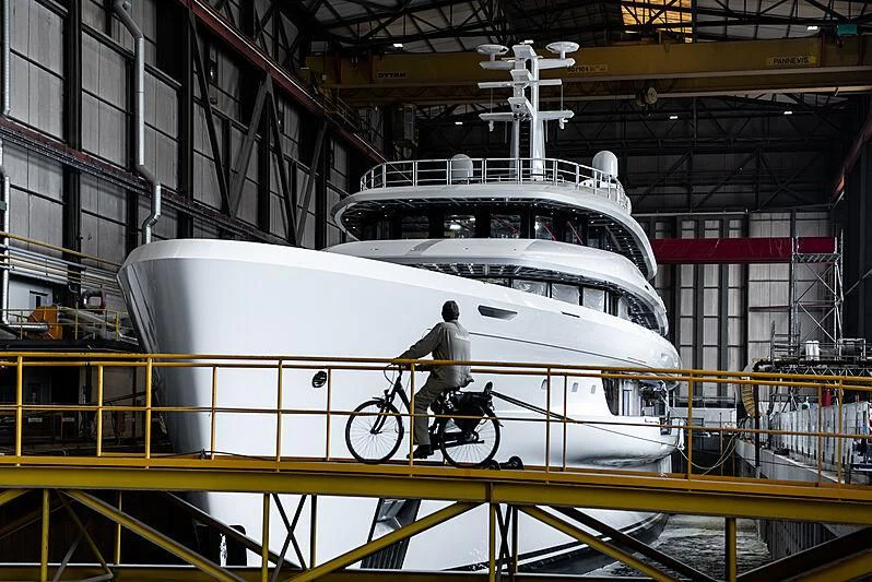 a person riding a bicycle on a boat in a building aboard ENERGY Yacht for Sale