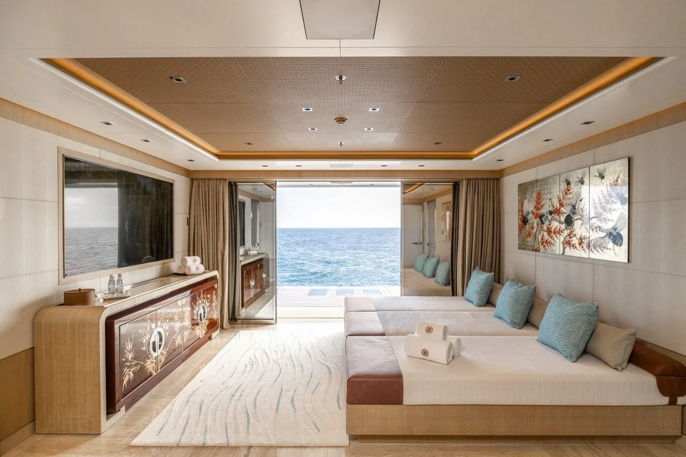 a large living room with a large window and a view of the ocean aboard ENERGY Yacht for Sale