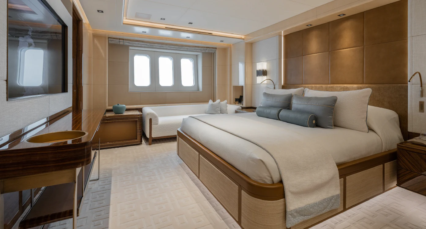 a room with a bed and a mirror aboard ENERGY Yacht for Sale