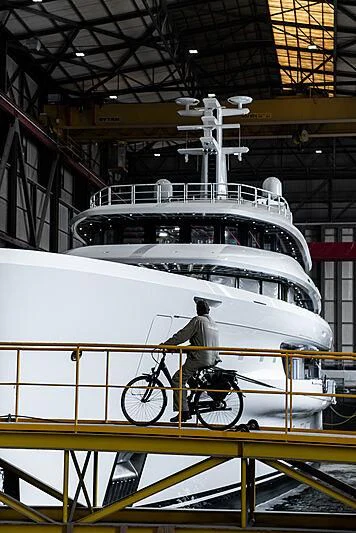 a person riding a bicycle on a boat aboard ENERGY Yacht for Sale