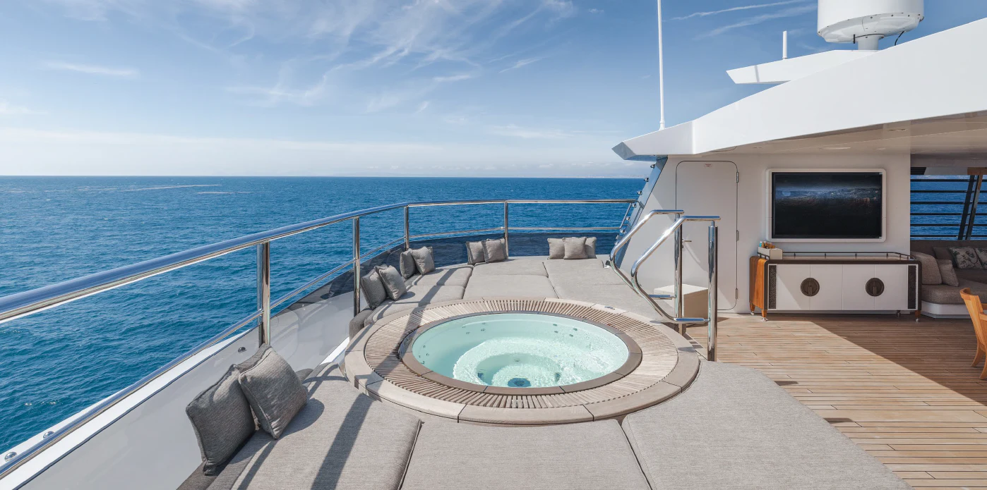 a large pool on a deck overlooking the ocean aboard ENERGY Yacht for Sale