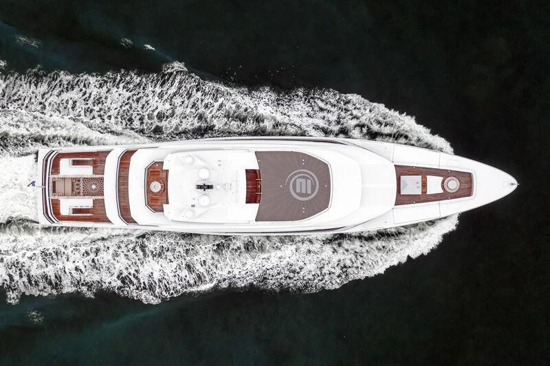 a red and white can on a beach aboard ENERGY Yacht for Sale