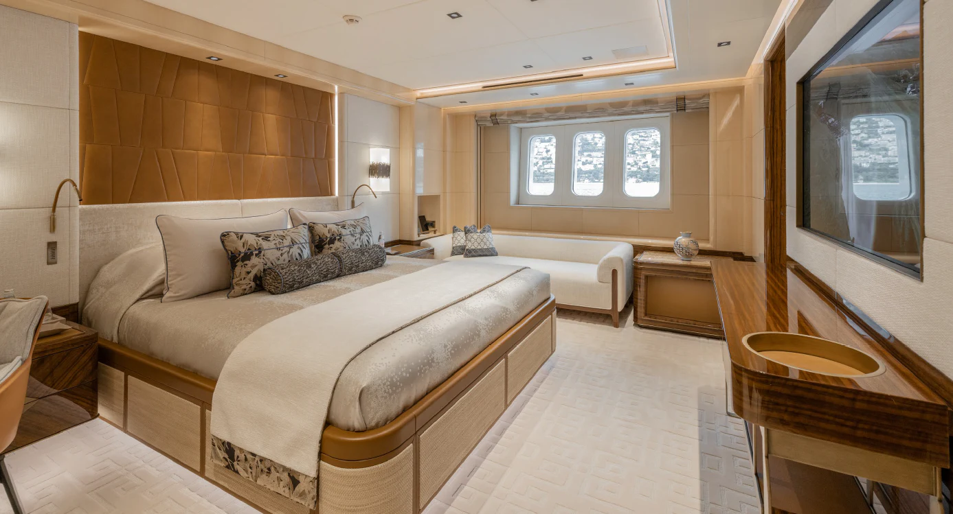 a large living room with a large bed and a large window aboard ENERGY Yacht for Sale