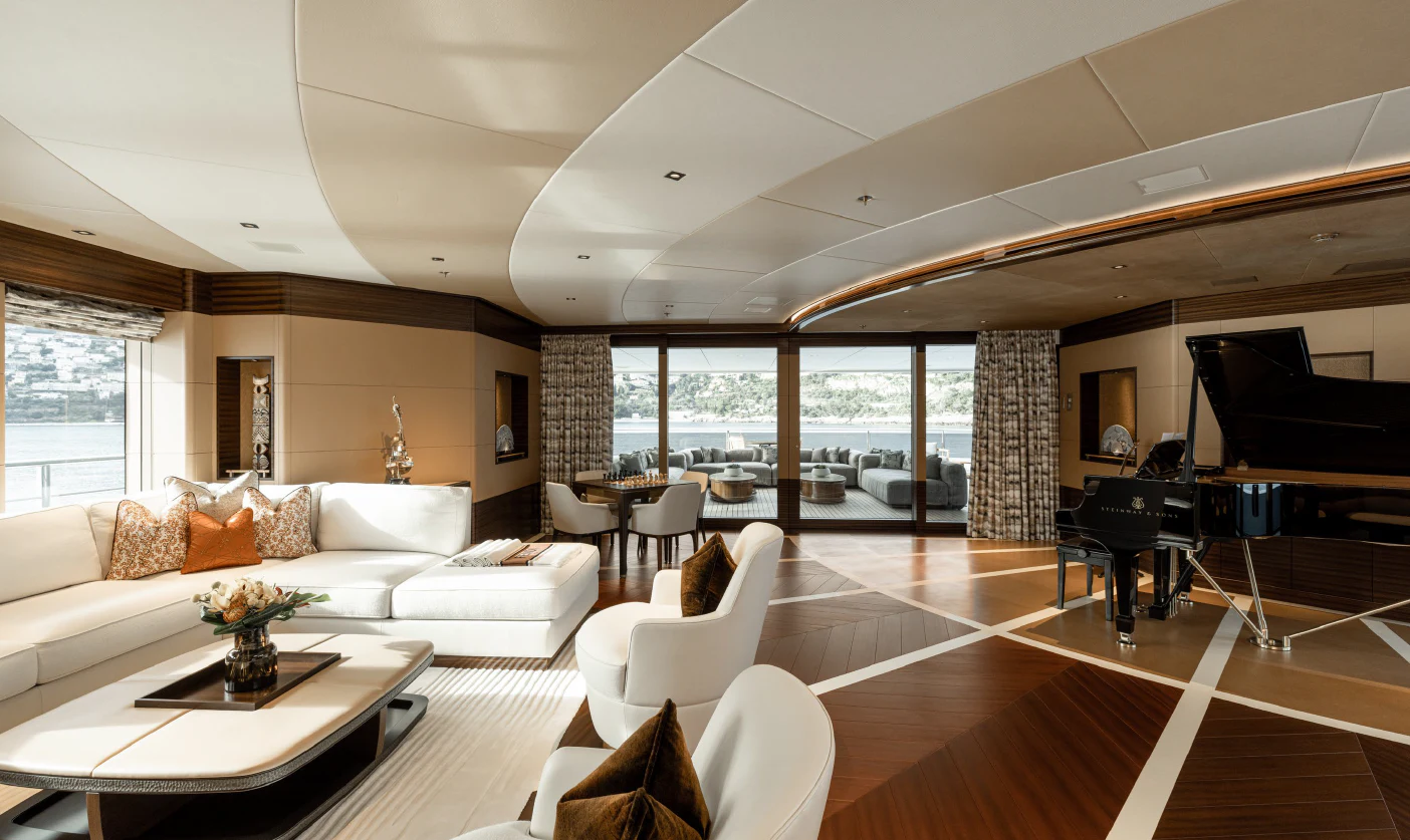 a living room with a piano aboard ENERGY Yacht for Sale