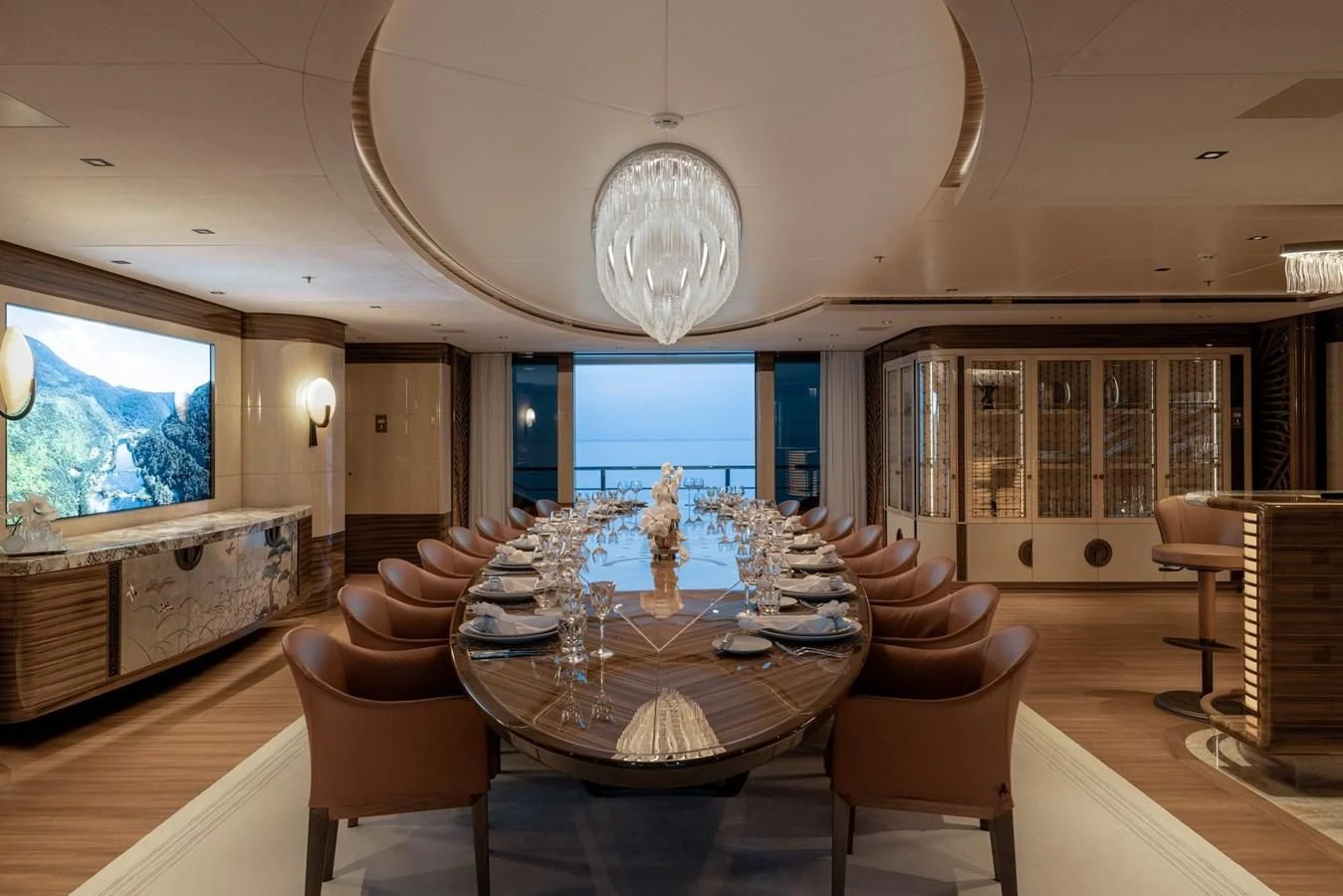 a large living room with a large chandelier aboard ENERGY Yacht for Sale
