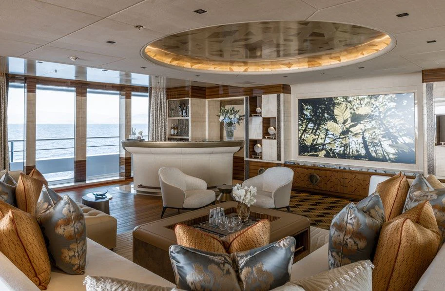 a living room with a large chandelier aboard ENERGY Yacht for Sale