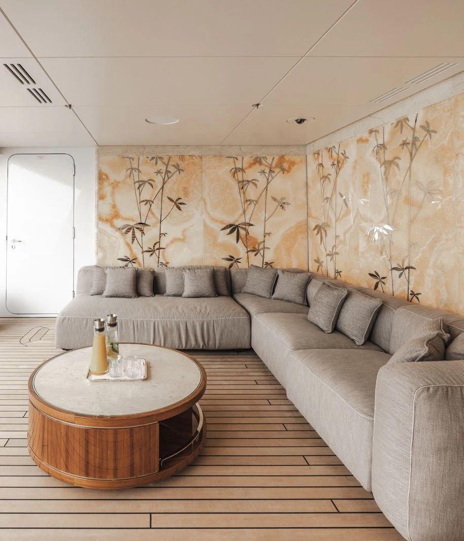 a living room with a couch and a coffee table aboard ENERGY Yacht for Sale