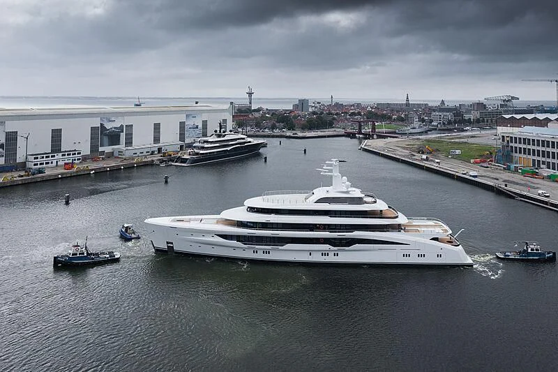 a large white boat on a river aboard ENERGY Yacht for Sale