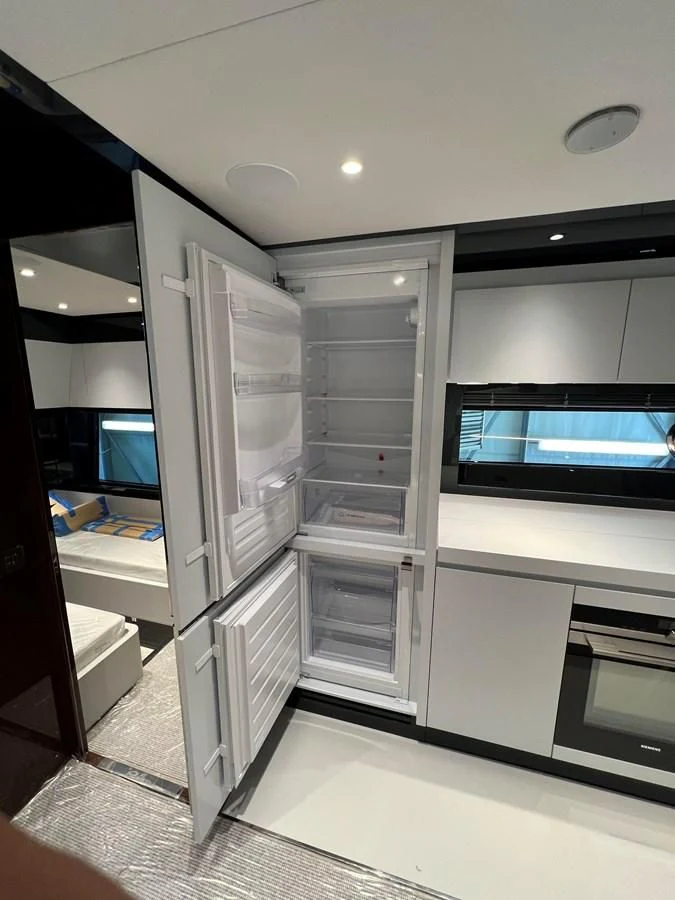 a room with a large glass door aboard RIVA 68' DIABLE Yacht for Sale