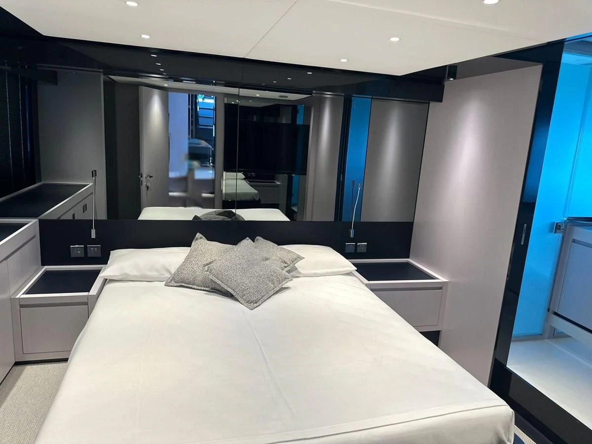 a large bed in a room aboard RIVA 68' DIABLE Yacht for Sale