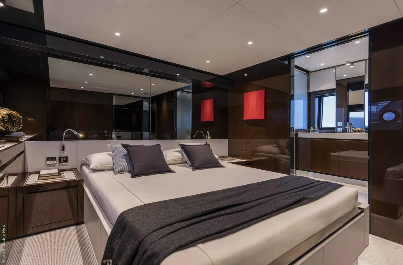 a large bed in a room aboard RIVA 68' DIABLE Yacht for Sale