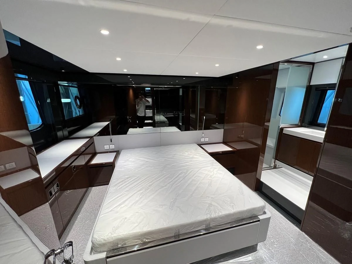 a room with a bed and a tv aboard RIVA 68' DIABLE Yacht for Sale