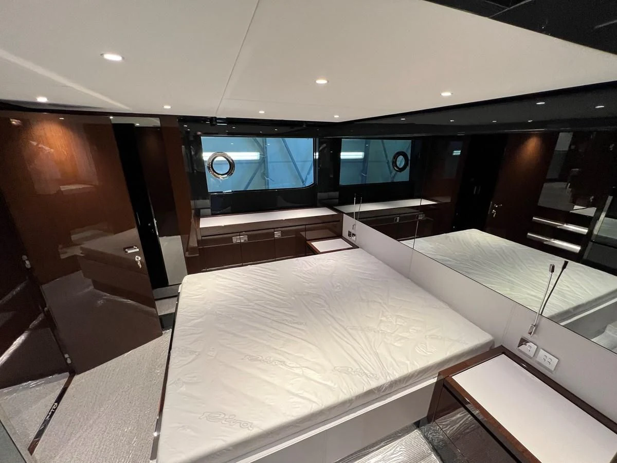 a room with a bed and a tv aboard RIVA 68' DIABLE Yacht for Sale