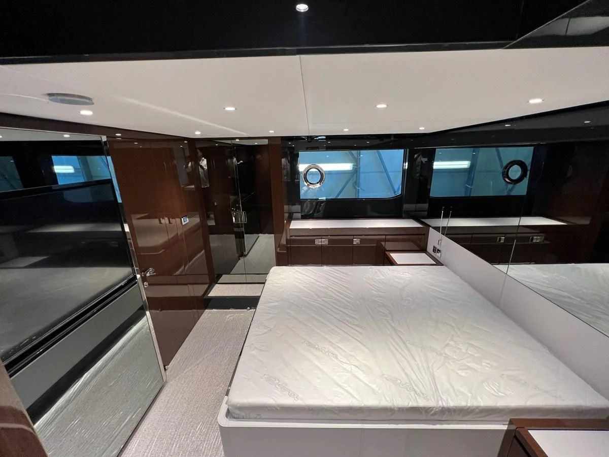 a room with a bed and a tv aboard RIVA 68' DIABLE Yacht for Sale