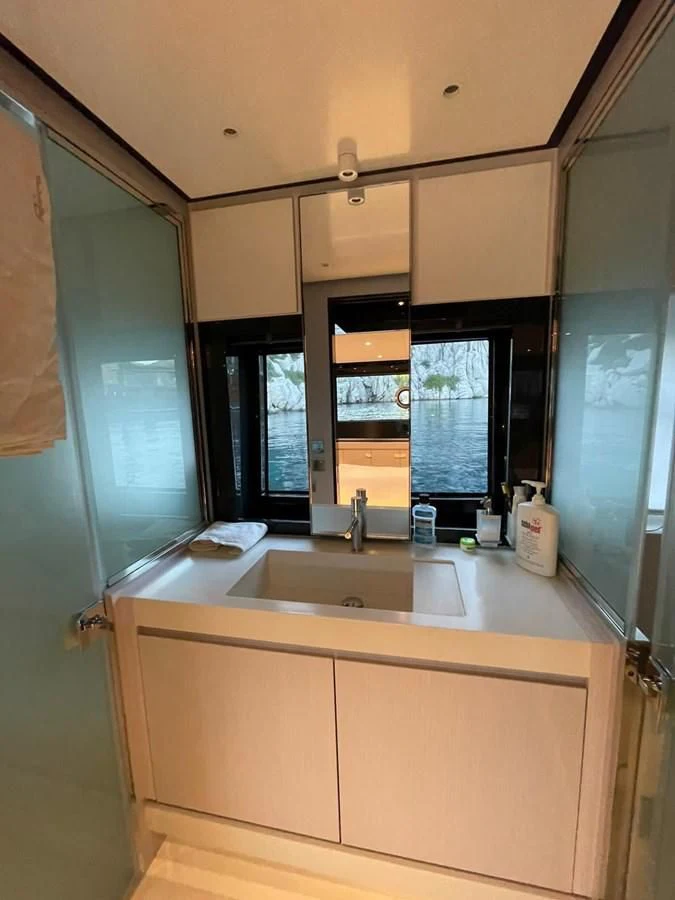 a kitchen with a sink and cabinets aboard RIVA 68' DIABLE Yacht for Sale