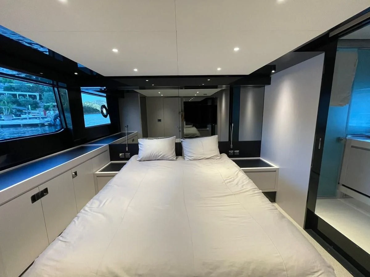 a large white bed in a room aboard RIVA 68' DIABLE Yacht for Sale