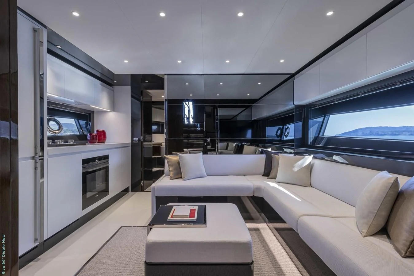 a living room with a white couch aboard RIVA 68' DIABLE Yacht for Sale