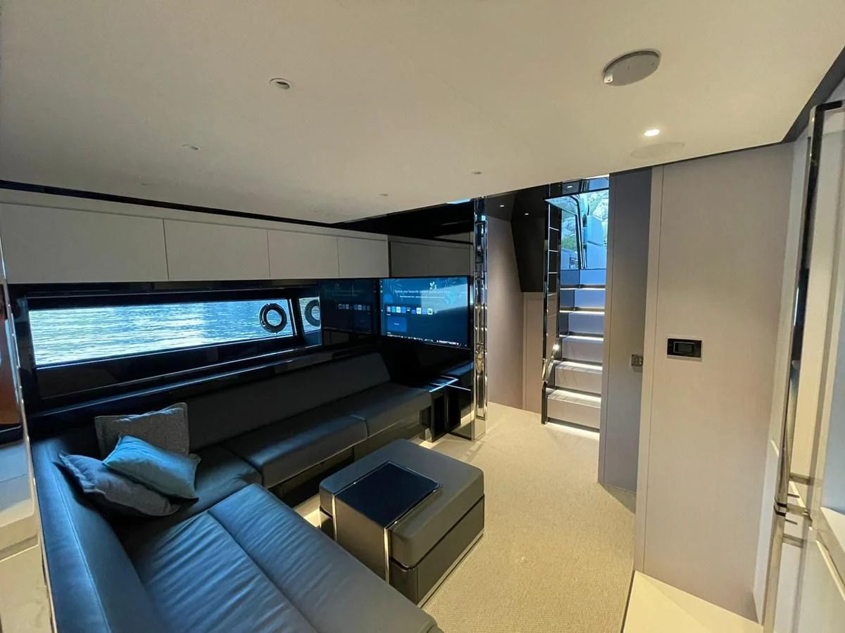 a room with a large tv aboard RIVA 68' DIABLE Yacht for Sale