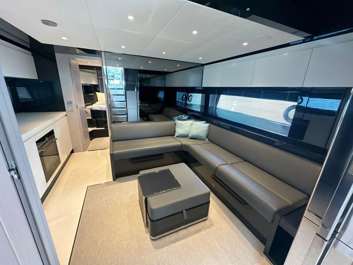 a modern looking living room aboard RIVA 68' DIABLE Yacht for Sale