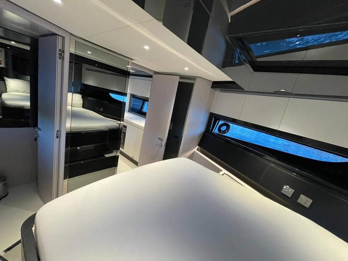 a room with a bed and a desk aboard RIVA 68' DIABLE Yacht for Sale