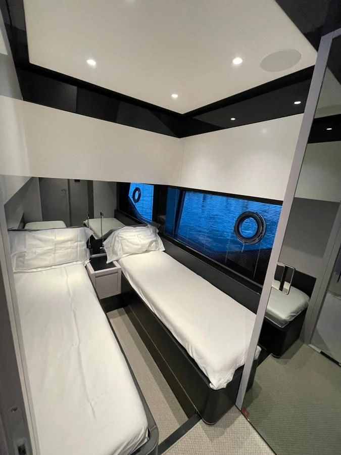 a room with a bed and a television aboard RIVA 68' DIABLE Yacht for Sale