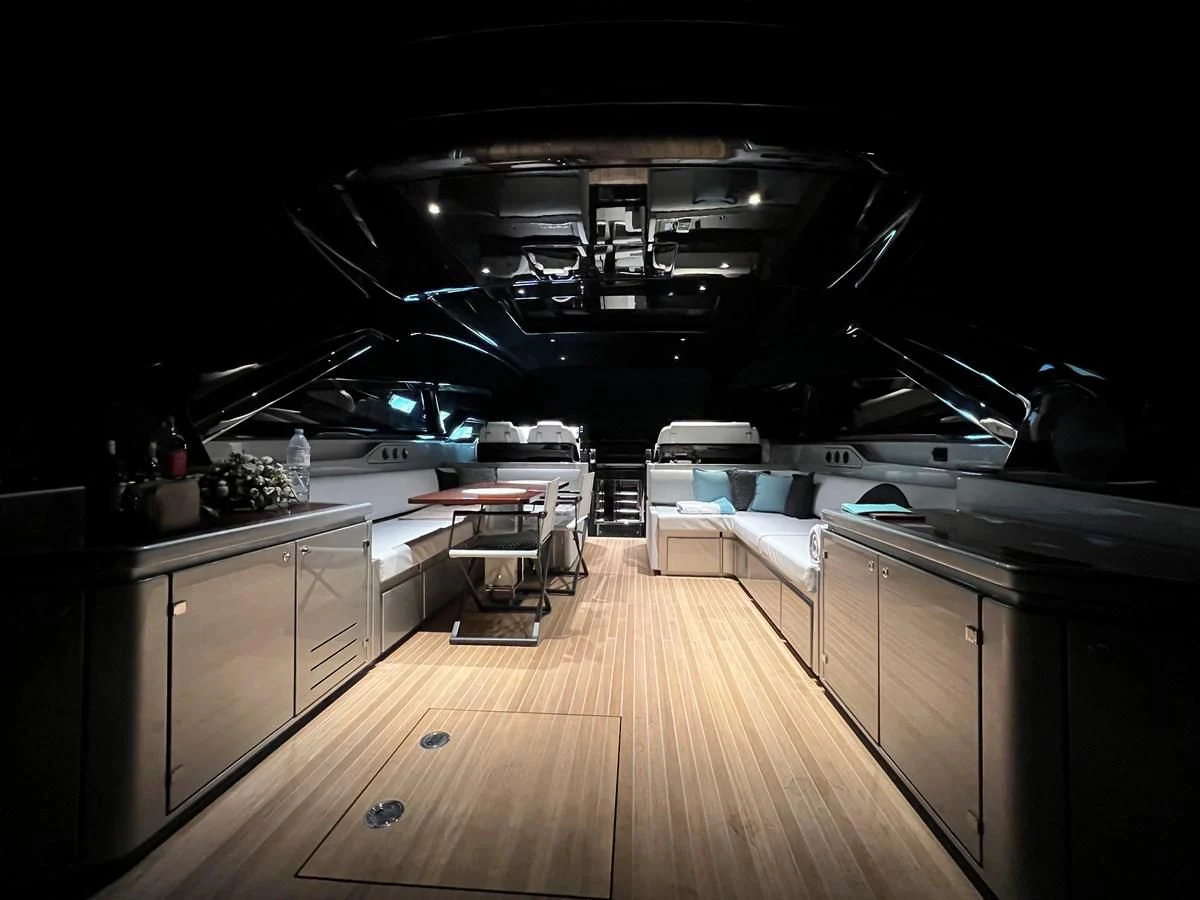 a kitchen with a wood floor aboard RIVA 68' DIABLE Yacht for Sale