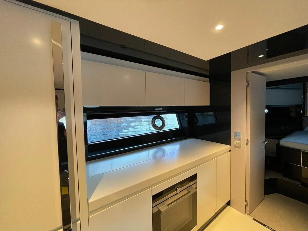 a large machine in a room aboard RIVA 68' DIABLE Yacht for Sale