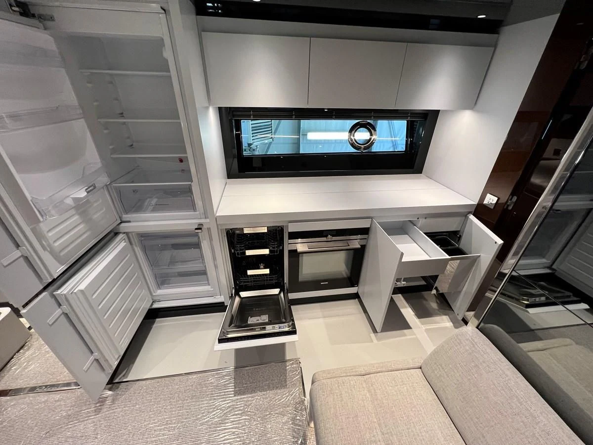 a room with a tv and a couch aboard RIVA 68' DIABLE Yacht for Sale