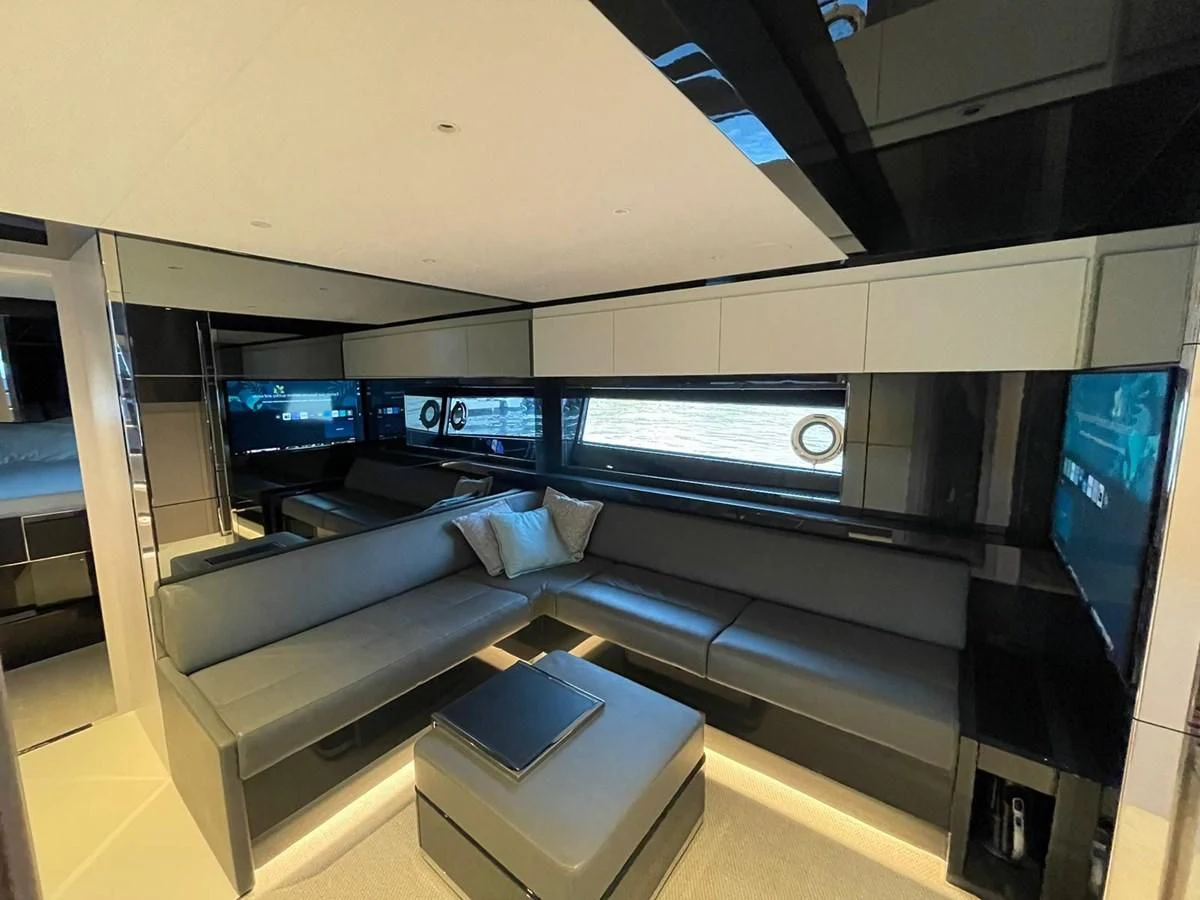 a room with a bed and a desk aboard RIVA 68' DIABLE Yacht for Sale