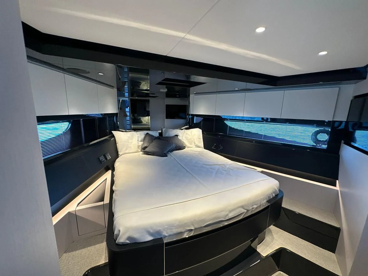 a room with a bed and a tv aboard RIVA 68' DIABLE Yacht for Sale