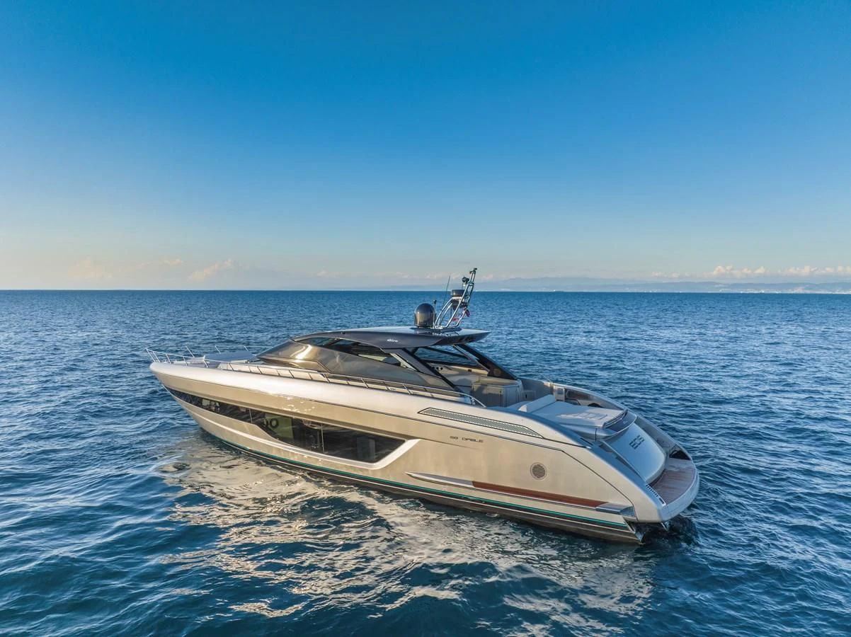 a white yacht on the water aboard RIVA 68' DIABLE Yacht for Sale