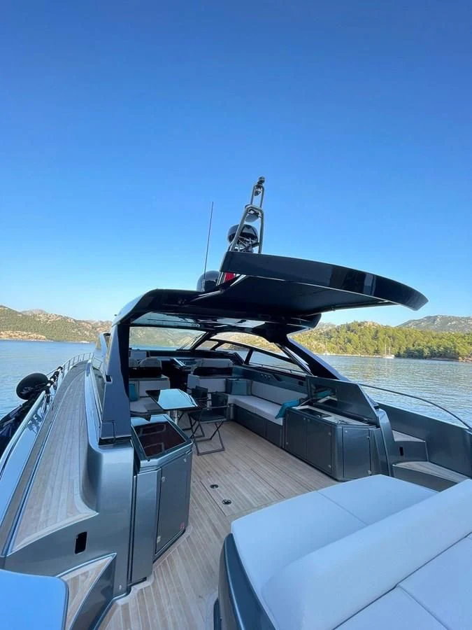 a black car on a road aboard RIVA 68' DIABLE Yacht for Sale