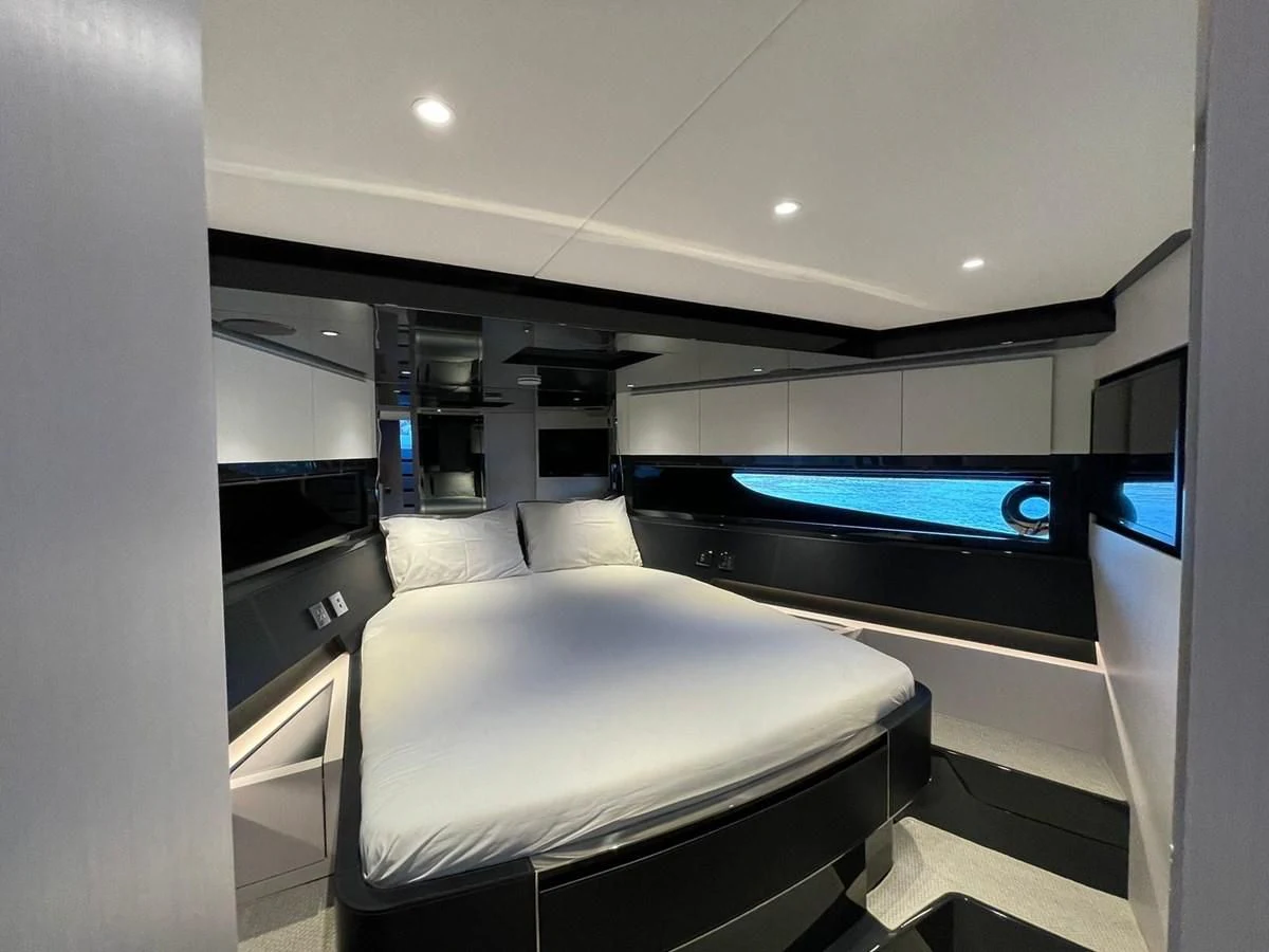 a room with a bed and a tv aboard RIVA 68' DIABLE Yacht for Sale