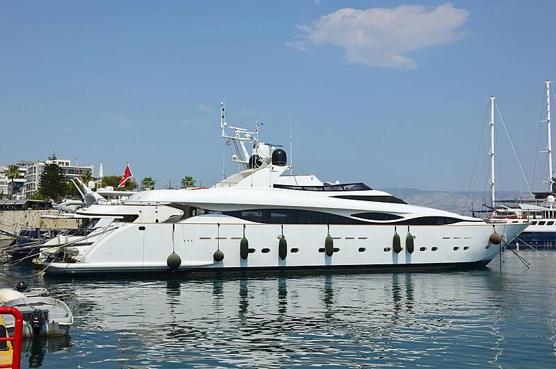 a white yacht in a harbor aboard PAREAKI II Yacht for Sale