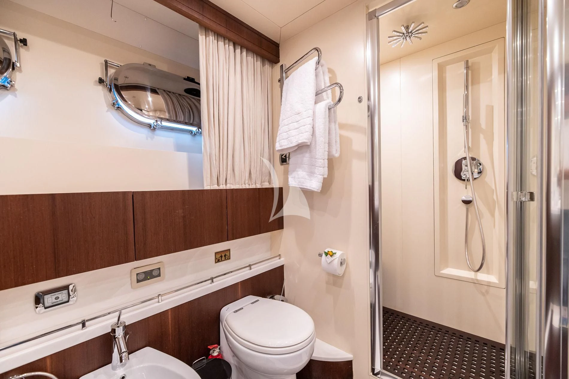 a bathroom with a toilet and a sink aboard PAREAKI II Yacht for Sale