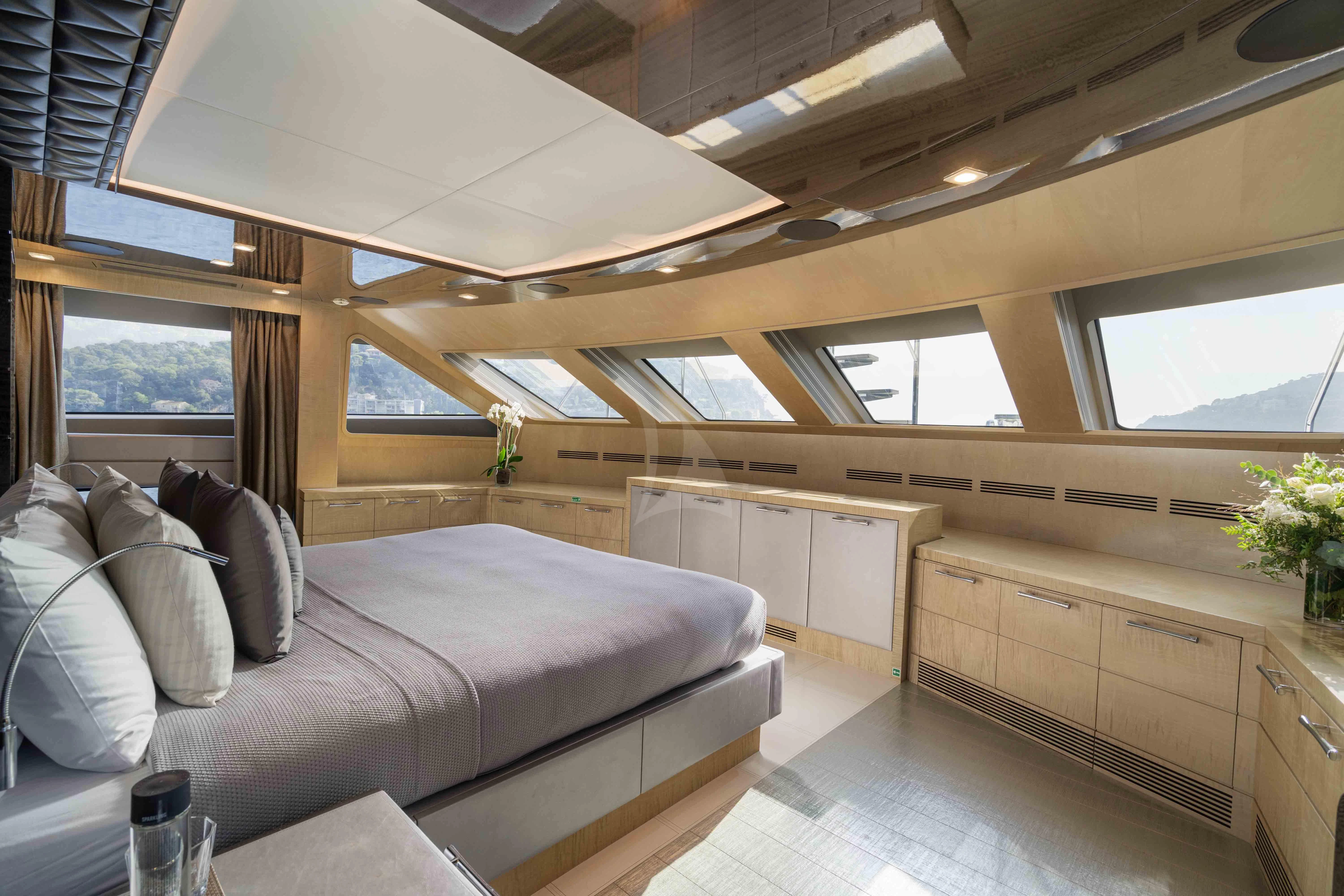 a living room with a couch and a large window aboard EDESIA Yacht for Sale