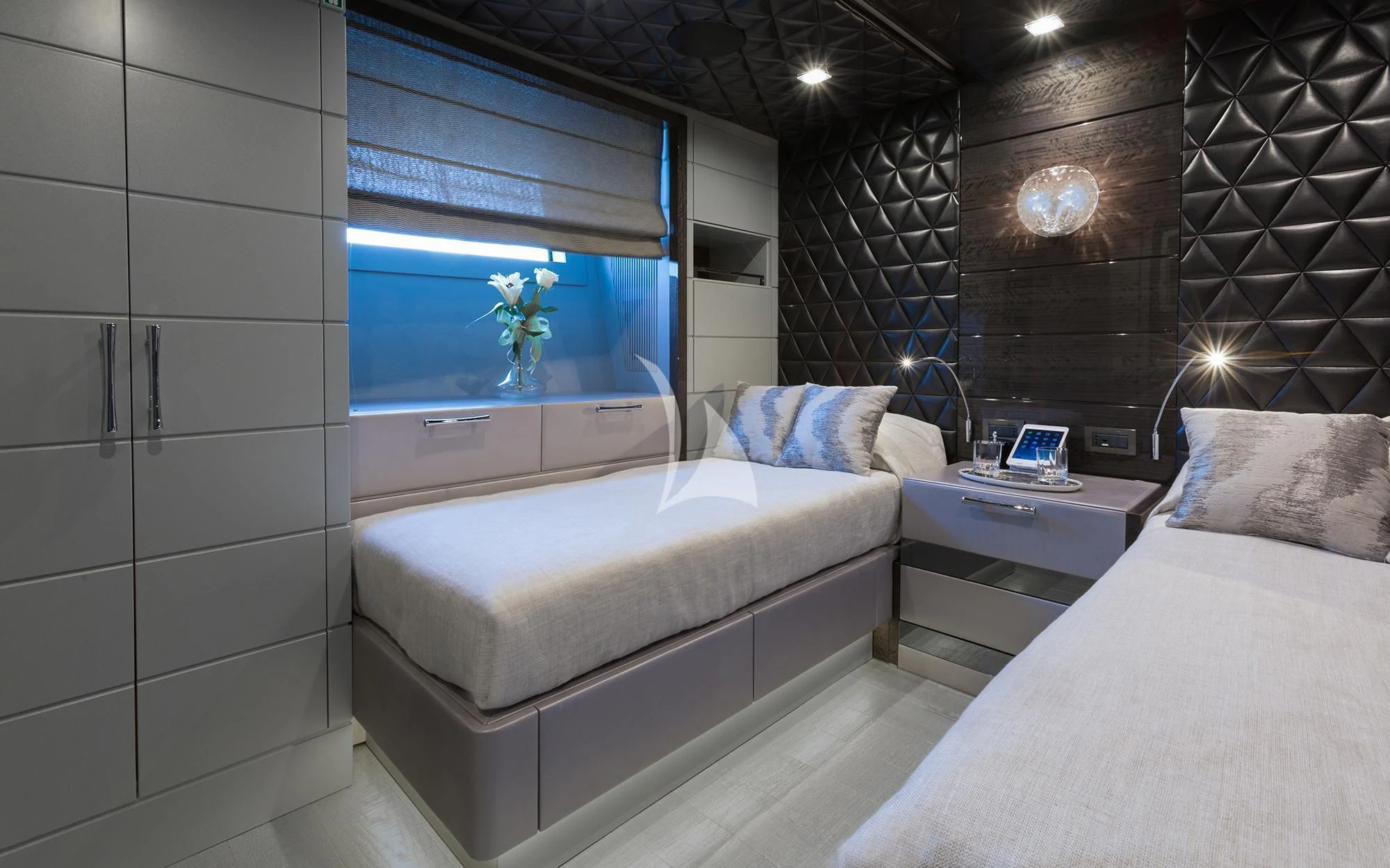 a room with a bed and a tv aboard EDESIA Yacht for Sale