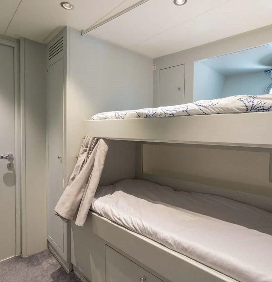 a bed with a white sheet aboard EDESIA Yacht for Sale
