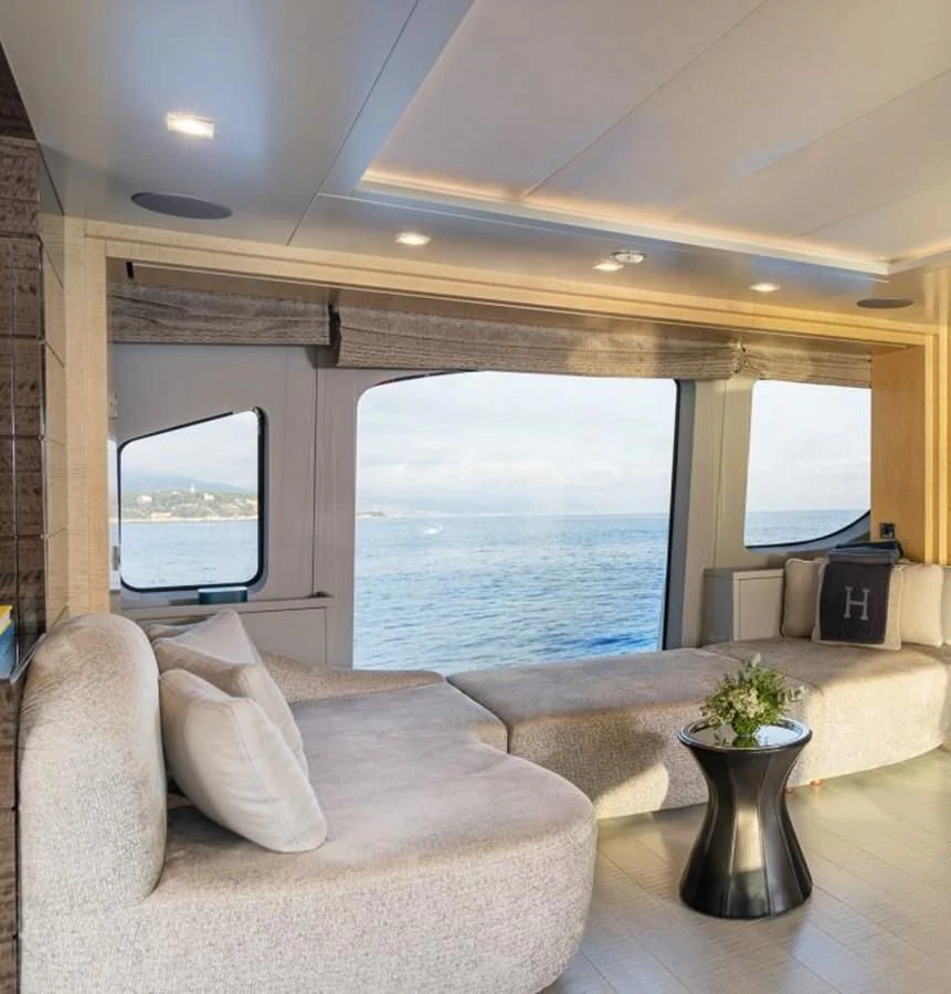 a living room with a large window aboard EDESIA Yacht for Sale