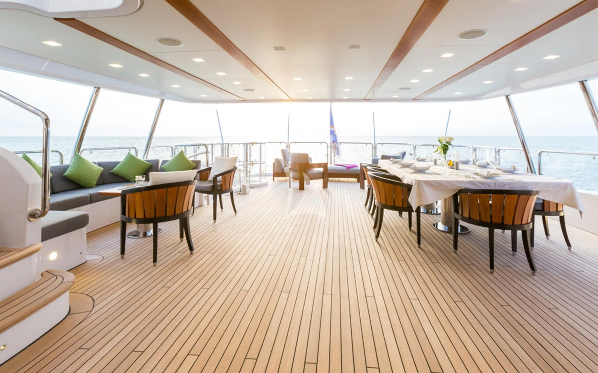 a room with tables and chairs aboard EDESIA Yacht for Sale