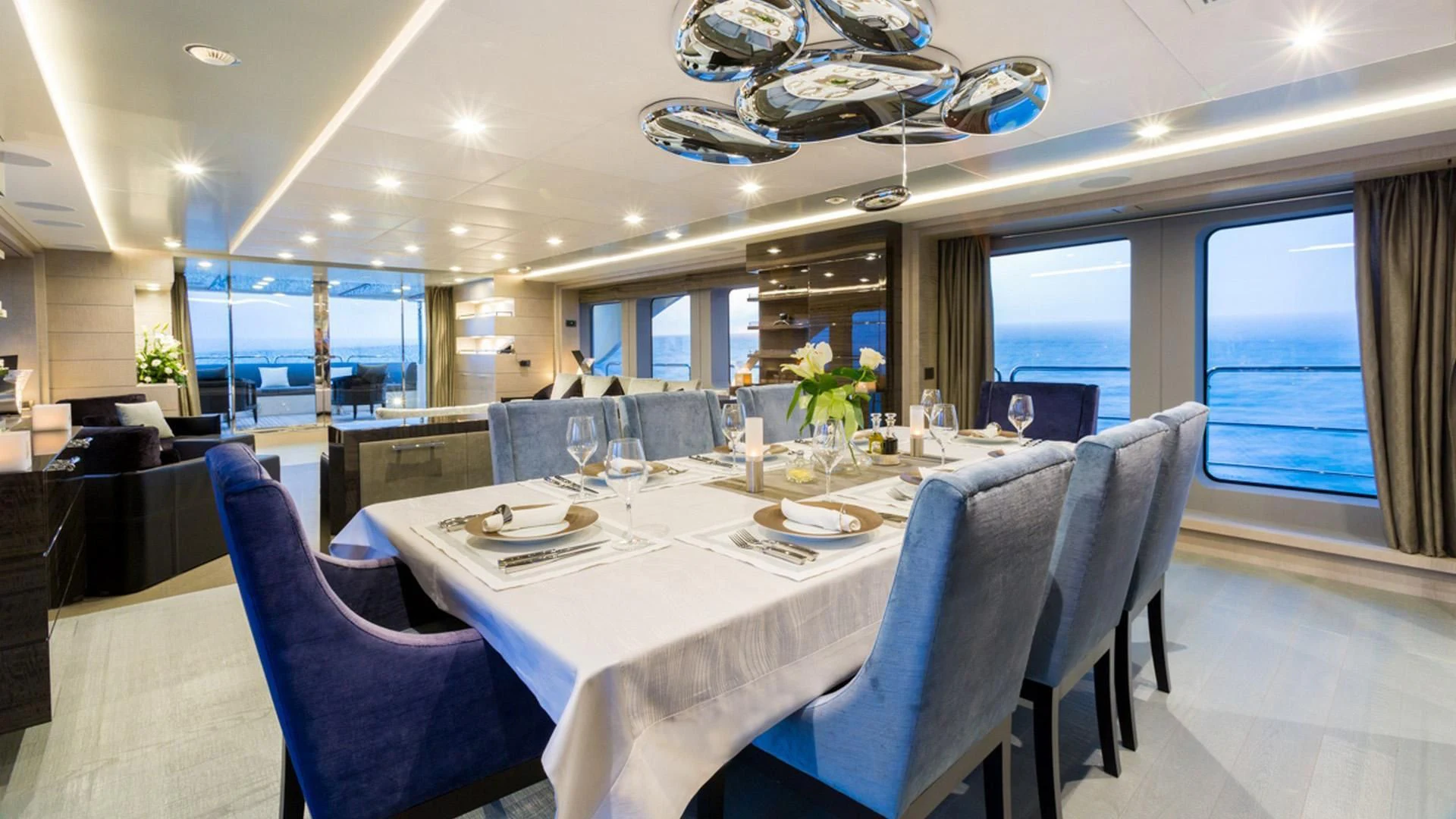 a dining room with a table and chairs aboard EDESIA Yacht for Sale