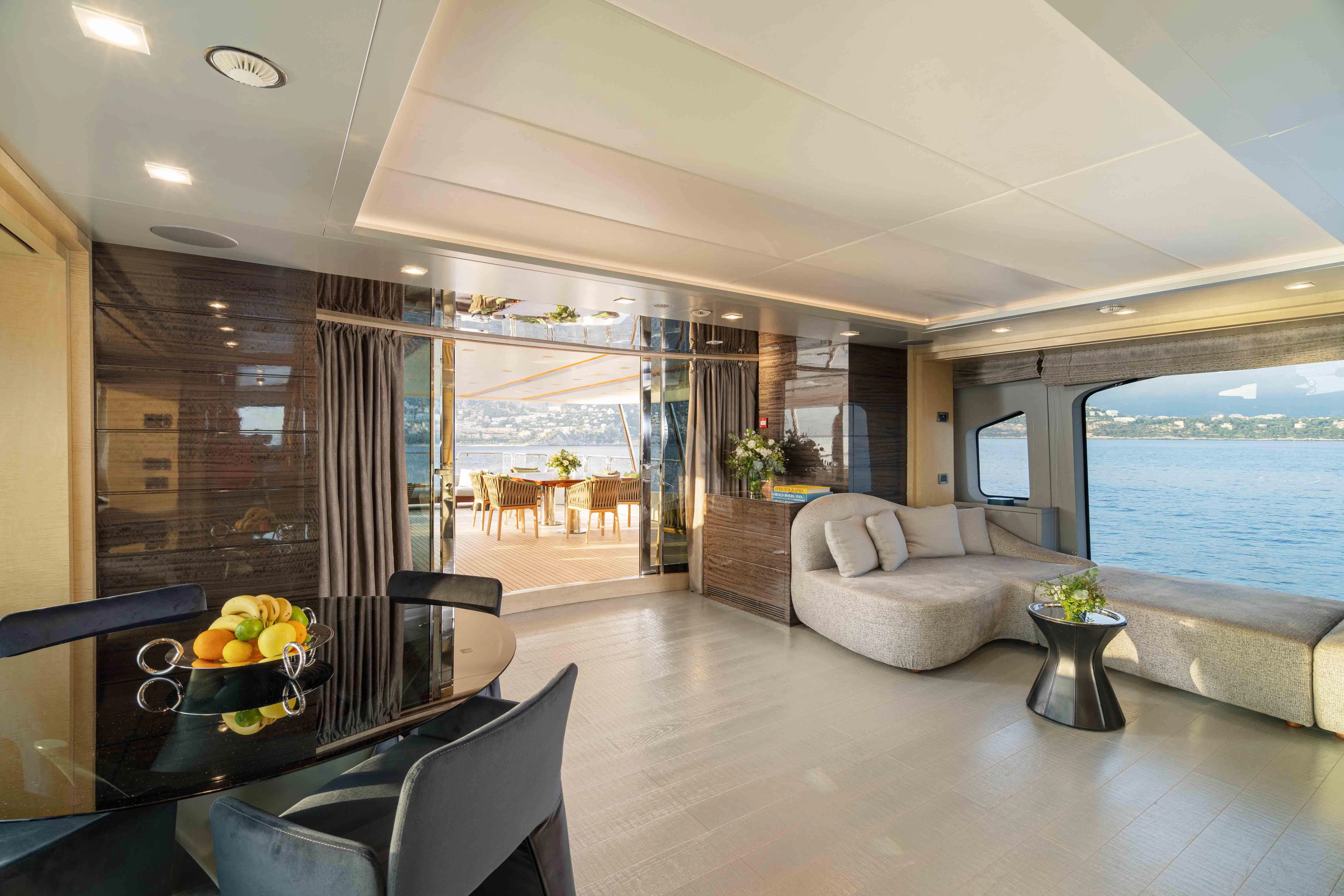 a living room with a large window aboard EDESIA Yacht for Sale