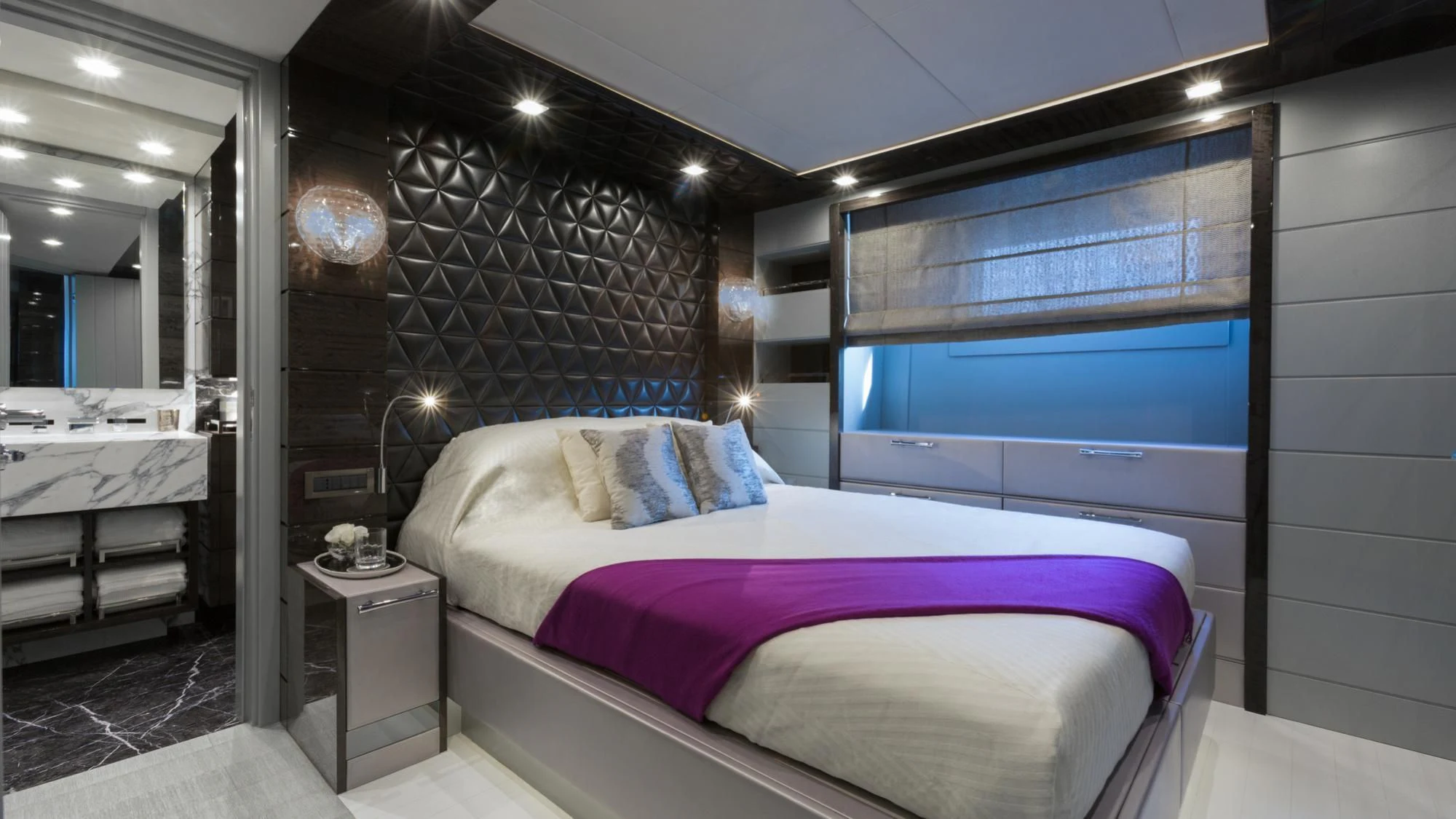 a bedroom with a large bed aboard EDESIA Yacht for Sale