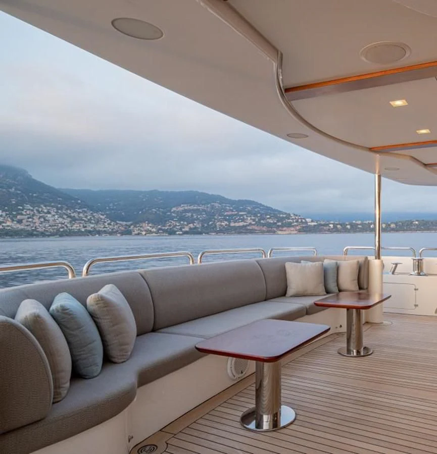 a lounge area with a view of a city and water aboard EDESIA Yacht for Sale