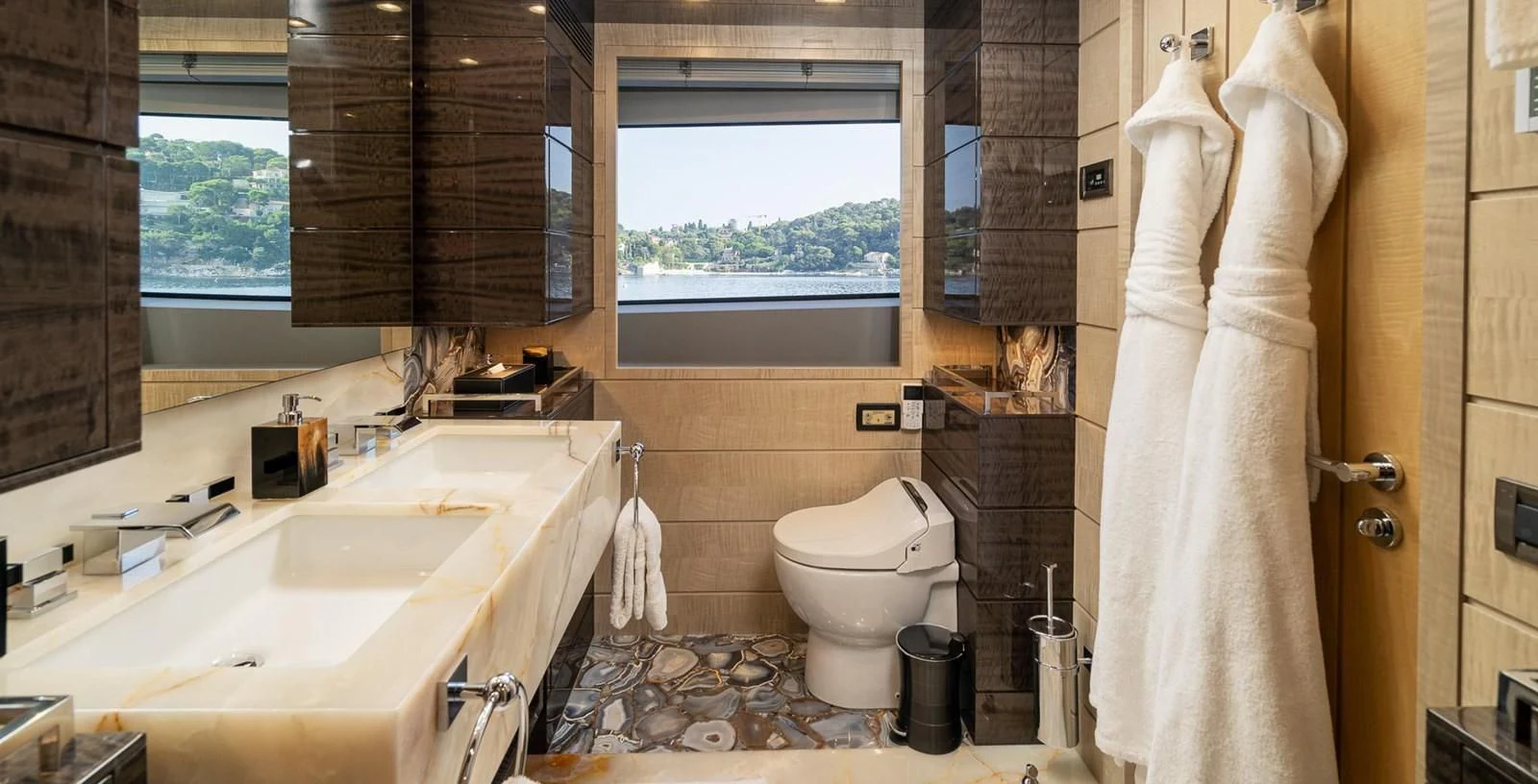 a bathroom with a toilet and sink aboard EDESIA Yacht for Sale