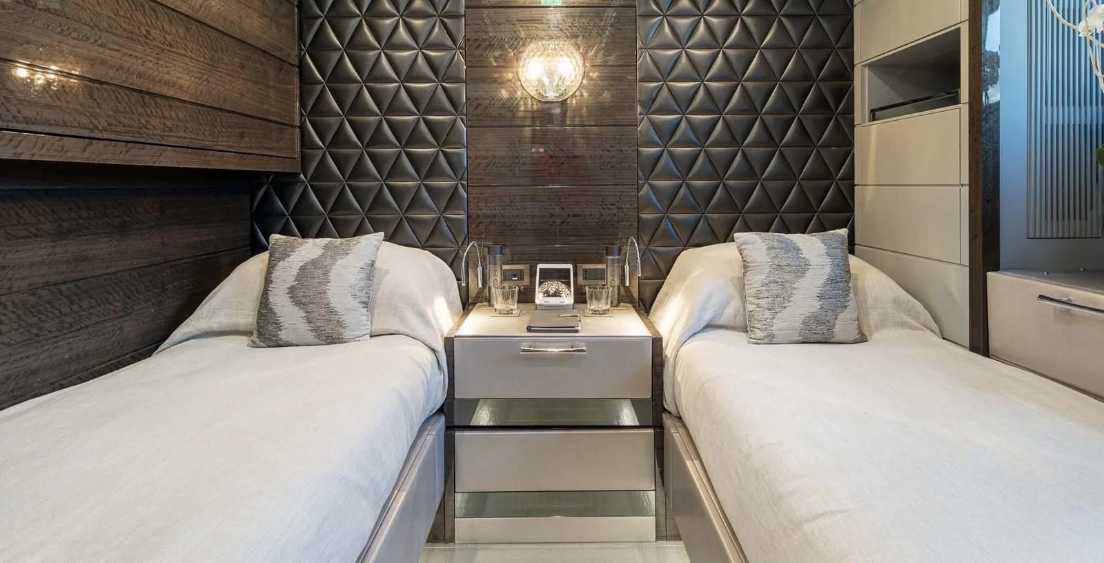 a room with a bed and a table aboard EDESIA Yacht for Sale