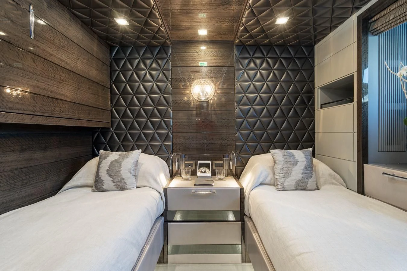 a room with a bed and a table aboard EDESIA Yacht for Sale