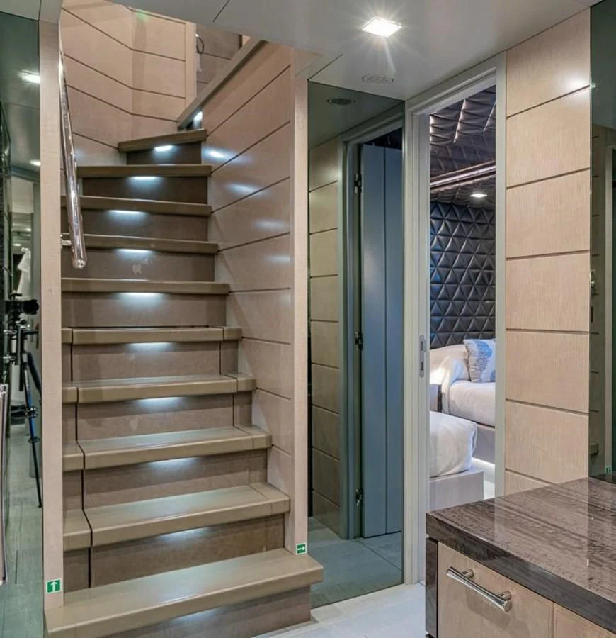 a bathroom with a wood staircase aboard EDESIA Yacht for Sale